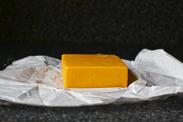 a block of orange cheese